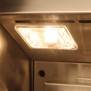 Stainless steel kitchen hood with a light bulb inside